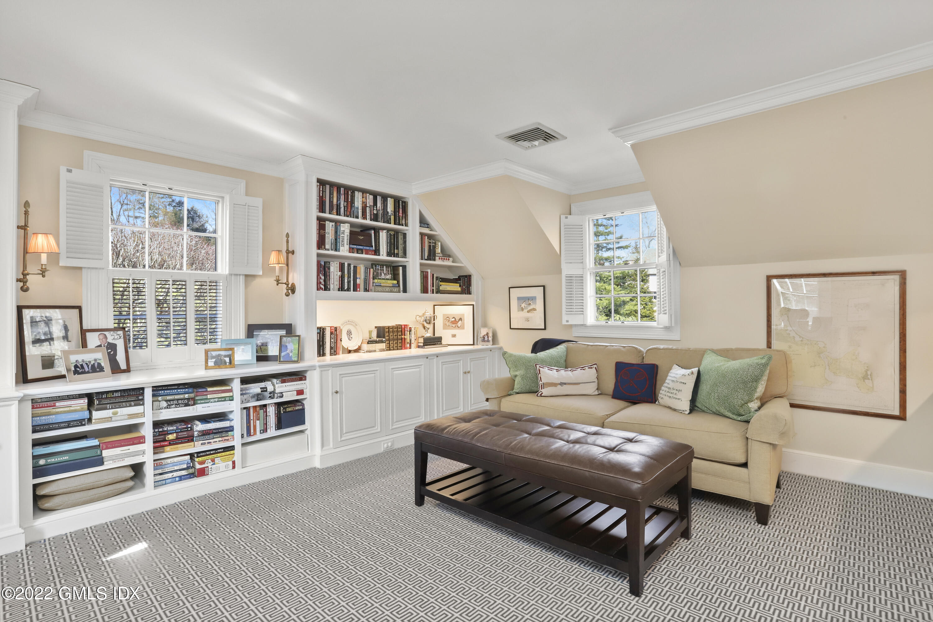 144 Pecksland Road Greenwich, CT 06831 - Photo 29 of 49 a living room with furniture and a book shelf