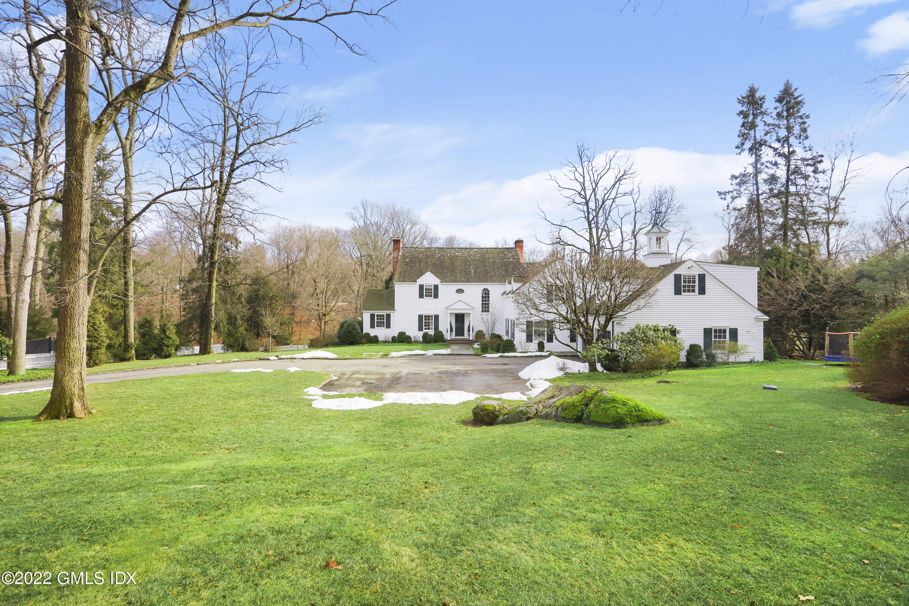 144 Pecksland Road Greenwich, CT 06831 - Photo 3 of 49 a view of a house with a big yard and fountain