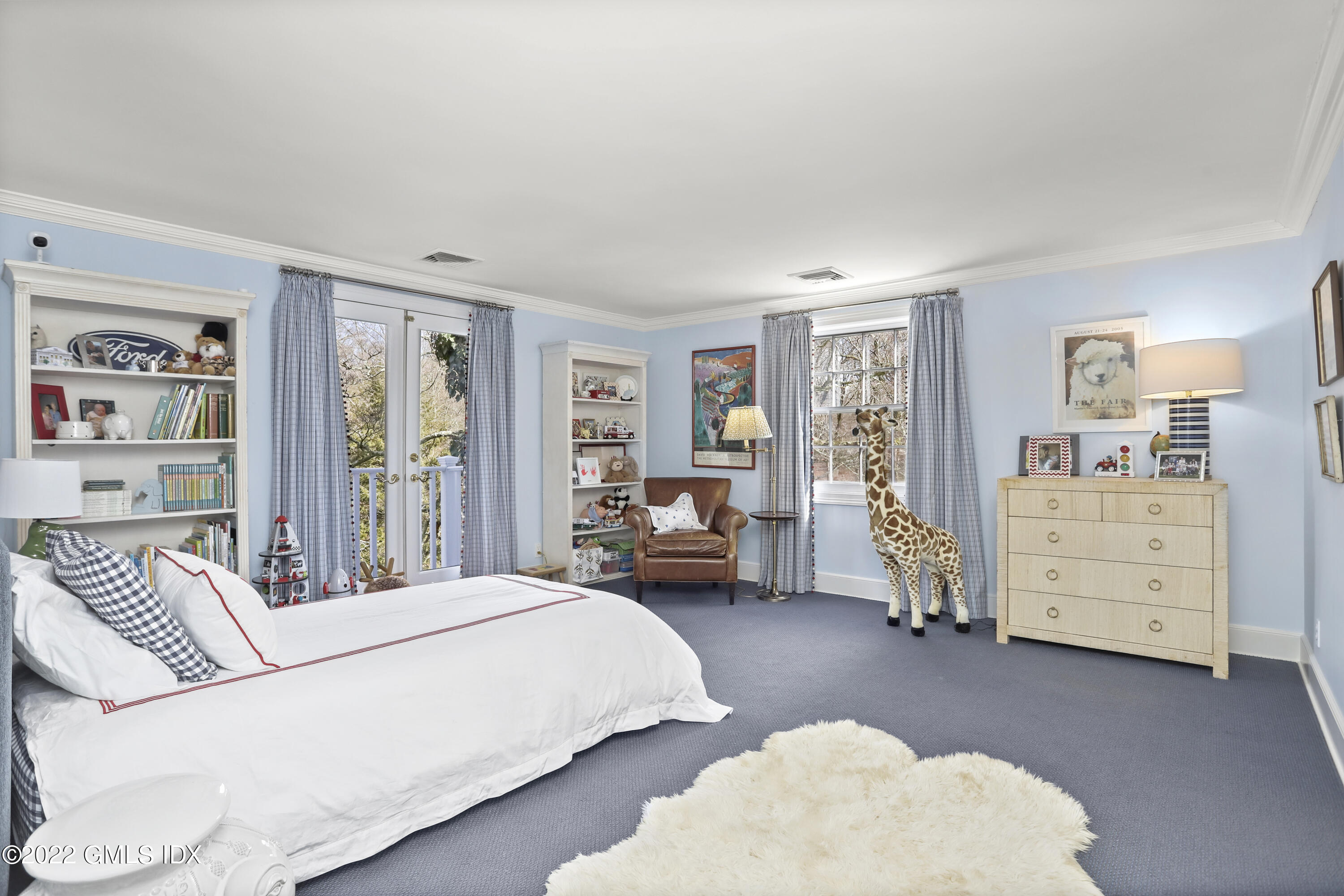 144 Pecksland Road Greenwich, CT 06831 - Photo 33 of 49 a bedroom with a bed couch and dresser