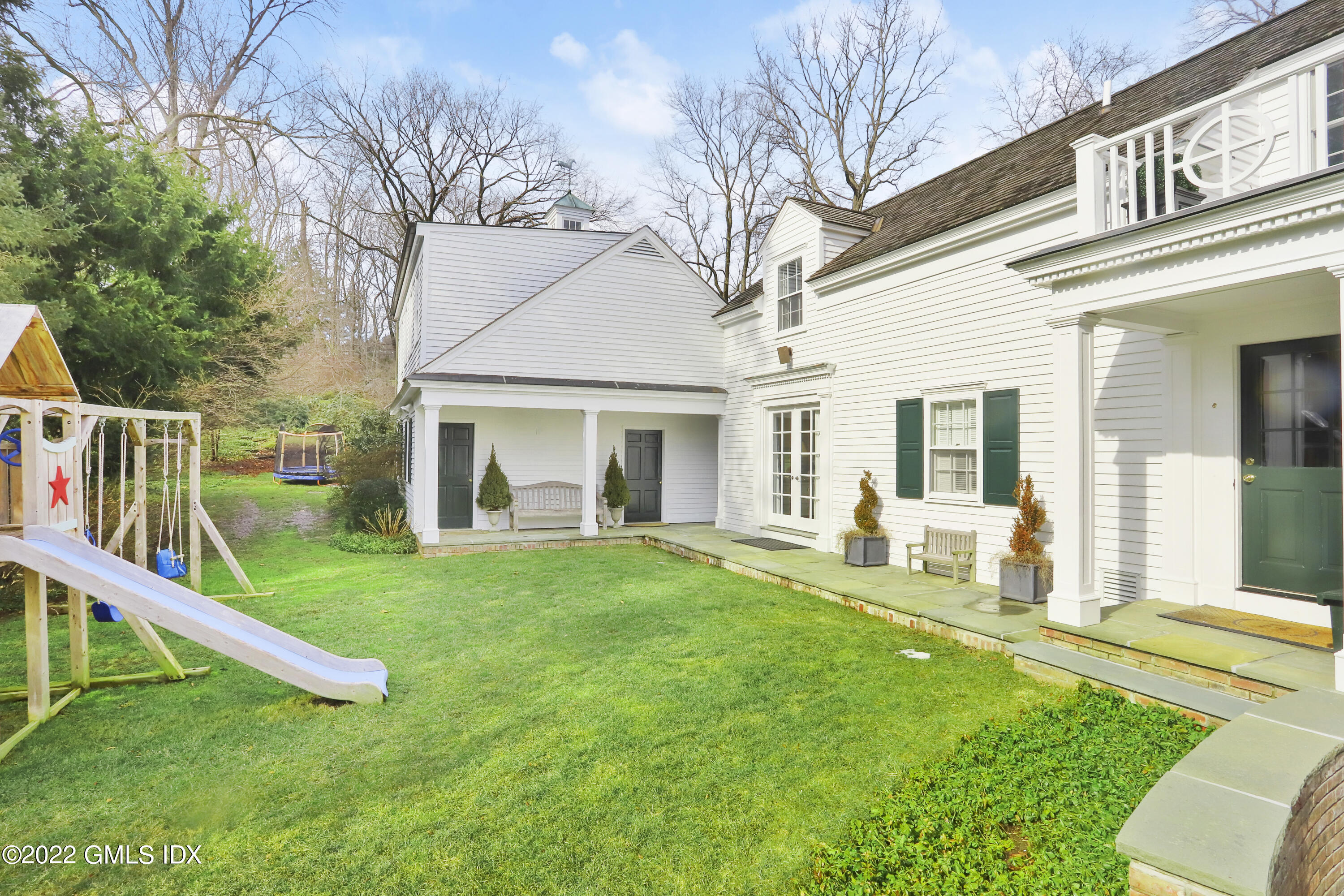 144 Pecksland Road Greenwich, CT 06831 - Photo 38 of 49 a front view of house with yard and green space