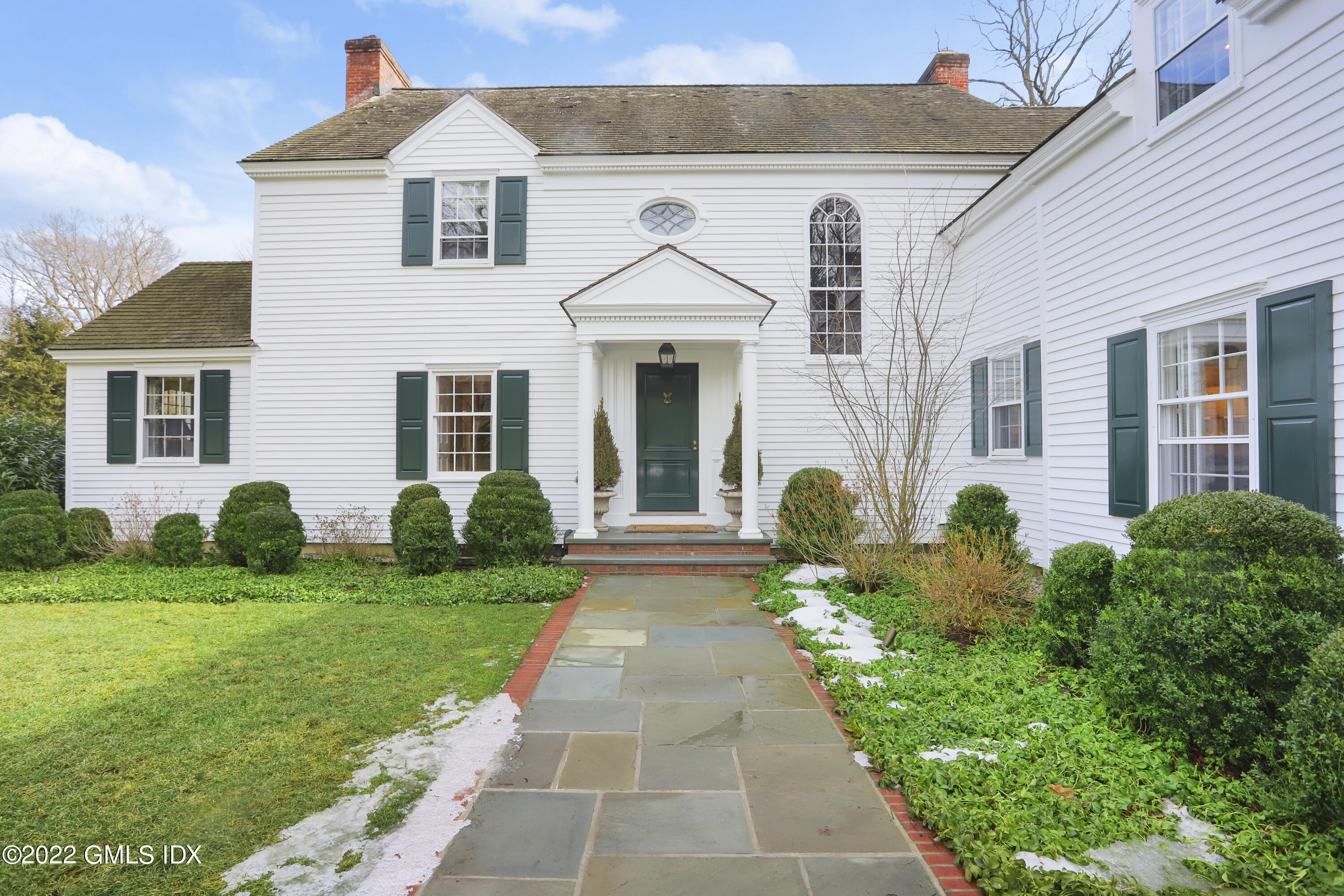 144 Pecksland Road Greenwich, CT 06831 - Photo 4 of 49 a front view of a house with garden