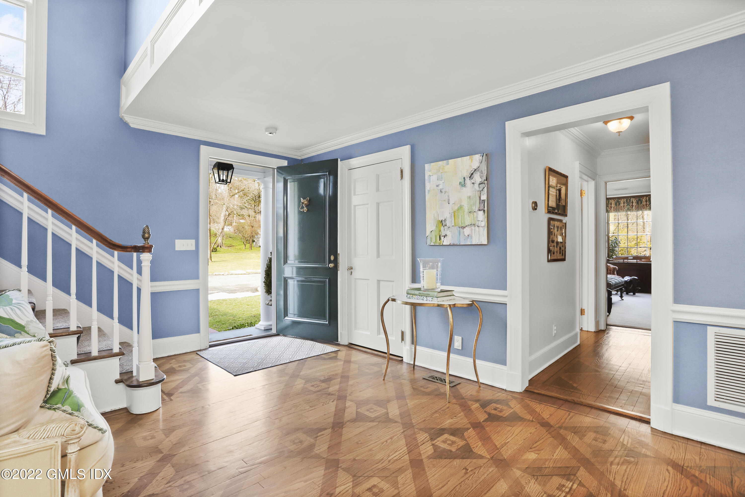 144 Pecksland Road Greenwich, CT 06831 - Photo 6 of 49 a view of an entryway with wooden floor and a livingroom