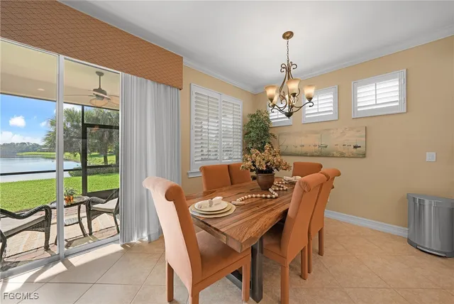 a spacious bedroom with a bed and a chandelier