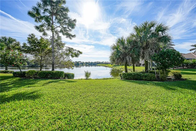 a view of a garden with a building in the background