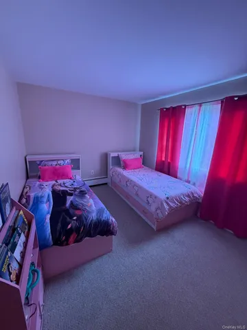 a bed room with a bed and a window