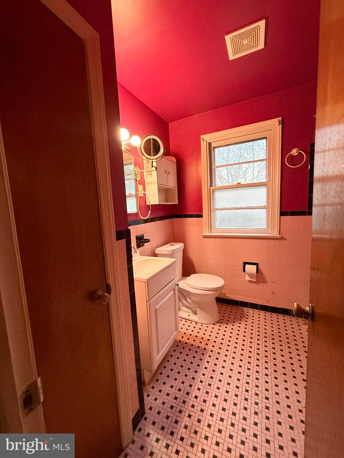 2732 Old Welsh Road Willow Grove, PA 19090 - Photo 8 of 18 a bathroom with a toilet a sink and mirror