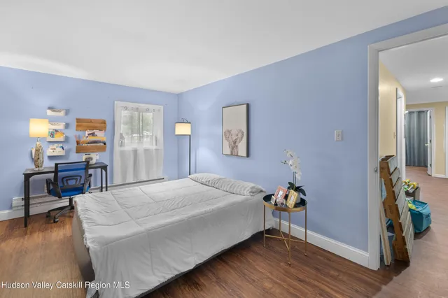 a bedroom with a bed and a table in it