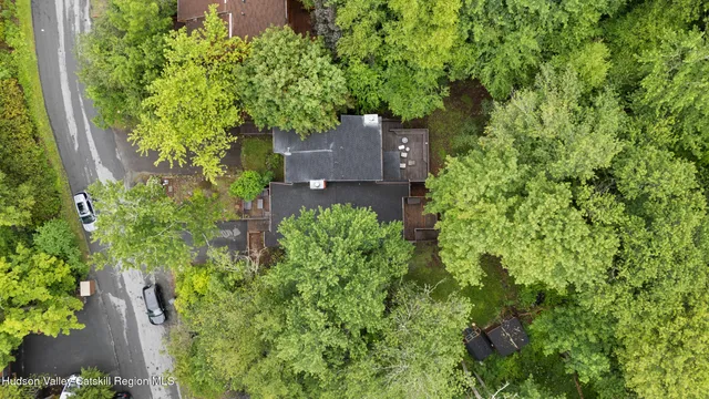 an aerial view of a house with a yard and garden