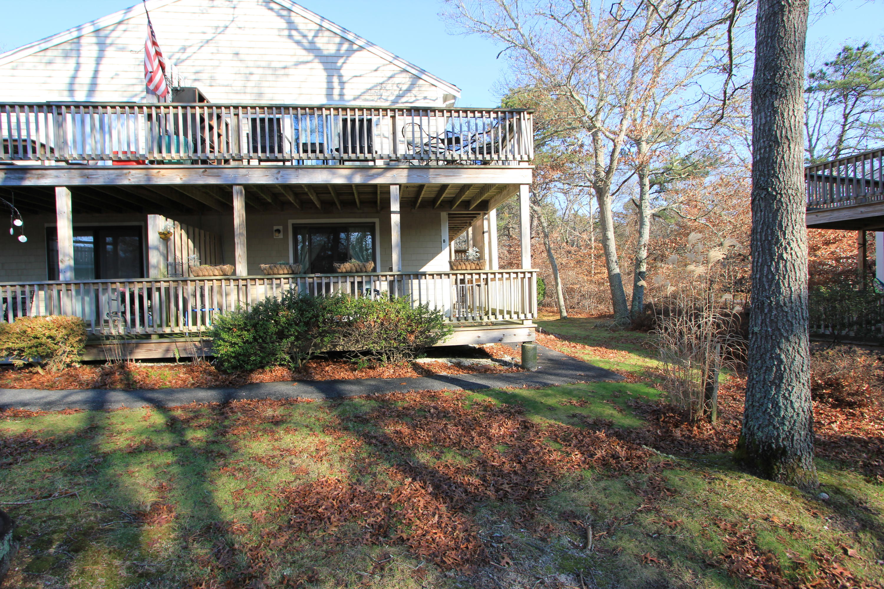 a front view of a house with swimming pool having outdoor seating