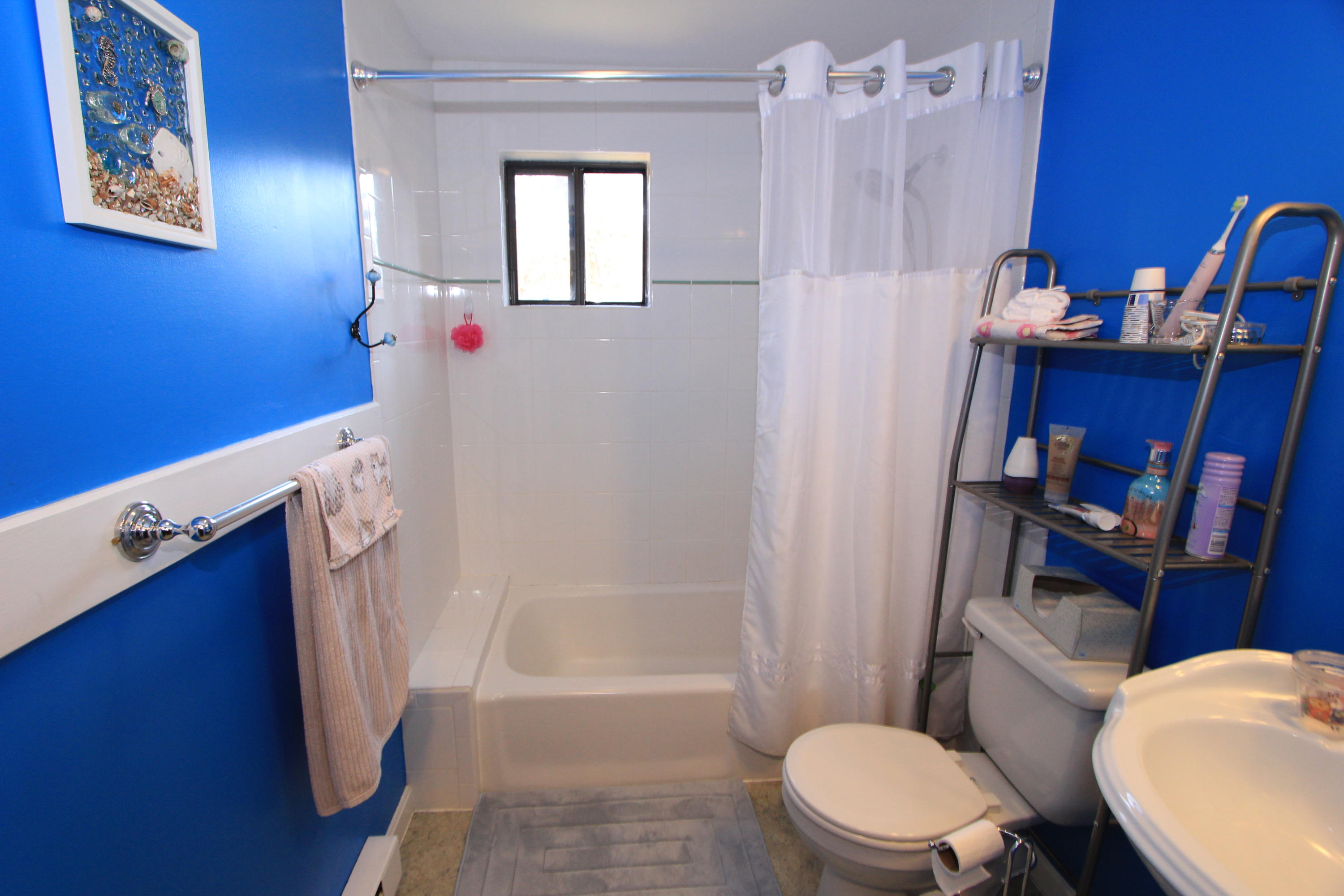 35 Ashumet Road, Unit 10B Mashpee, MA 02649 - Photo 11 of 13 a bathroom with a sink a toilet and shower