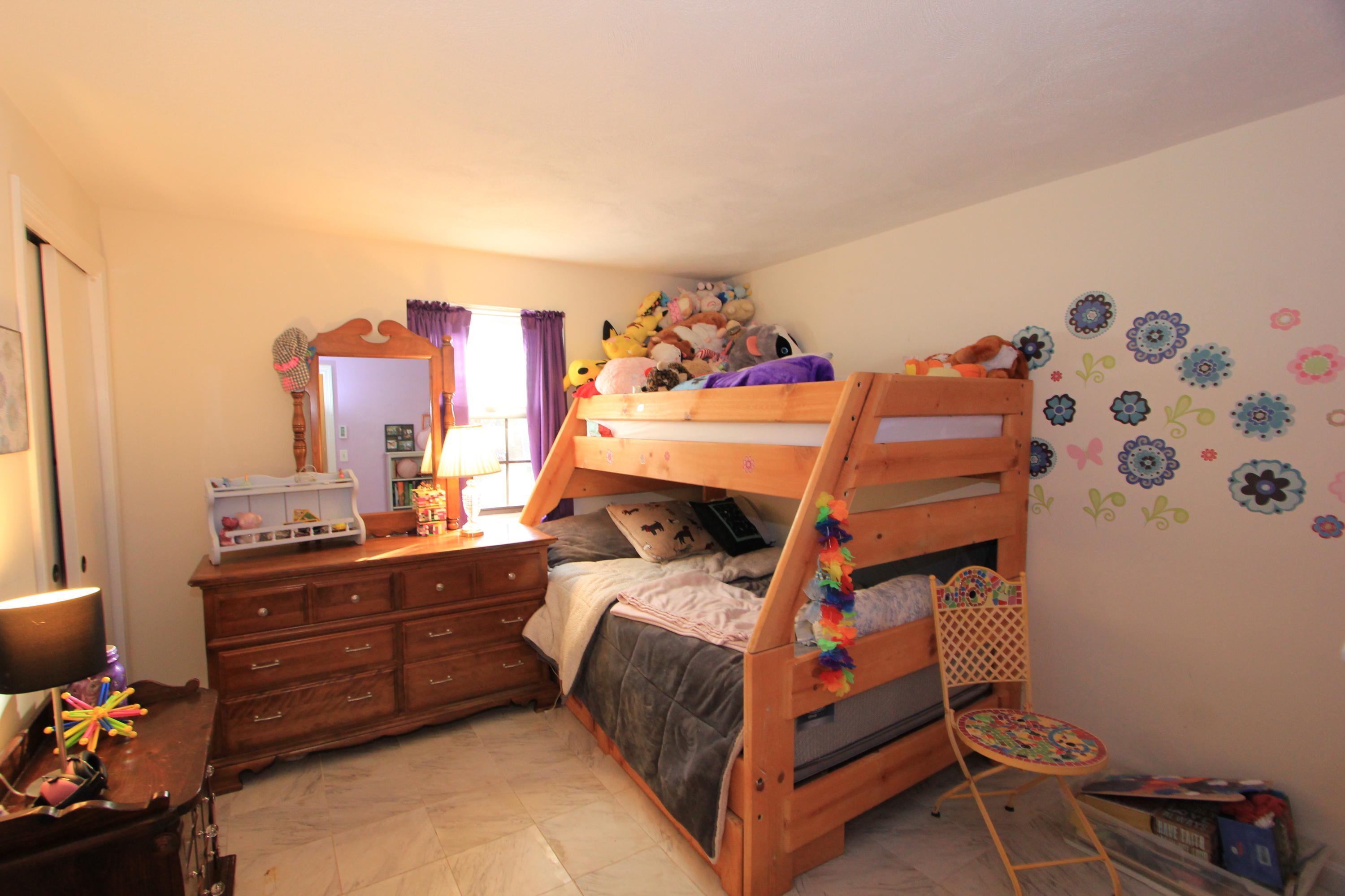 35 Ashumet Road, Unit 10B Mashpee, MA 02649 - Photo 13 of 13 a bedroom with a bed and wooden floor