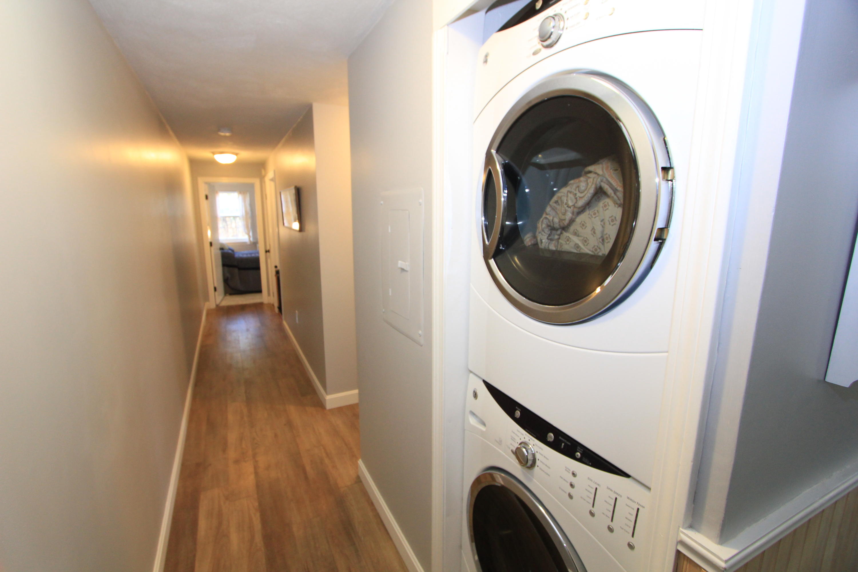 35 Ashumet Road, Unit 10B Mashpee, MA 02649 - Photo 10 of 13 a view of a hallway with washer and dryer