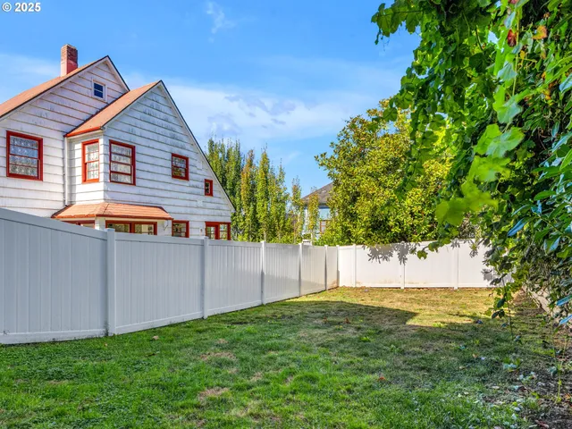 a backyard of a house with lots of green space