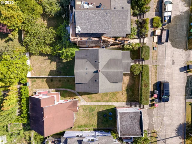 an aerial view of houses with outdoor space