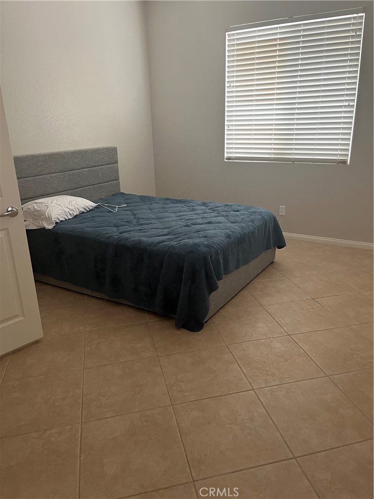68399 Panorama Drive Desert Hot Springs, CA 92240 - Photo 2 of 4 a bedroom with a bed and window