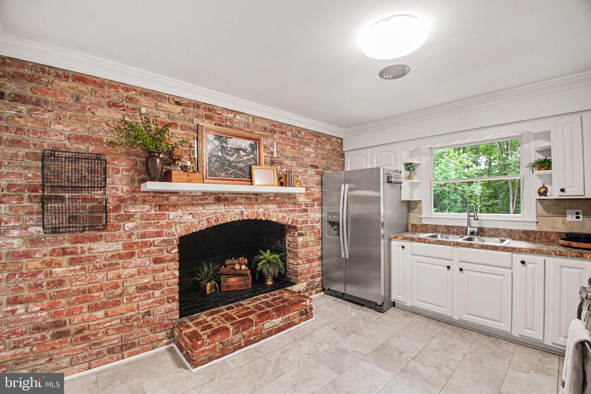 10224 Mill Pond Road Spotsylvania, VA 22551 - Photo 9 of 52 Kitchen w/LARGE Woodburning Fireplace & Vinyl Tile
