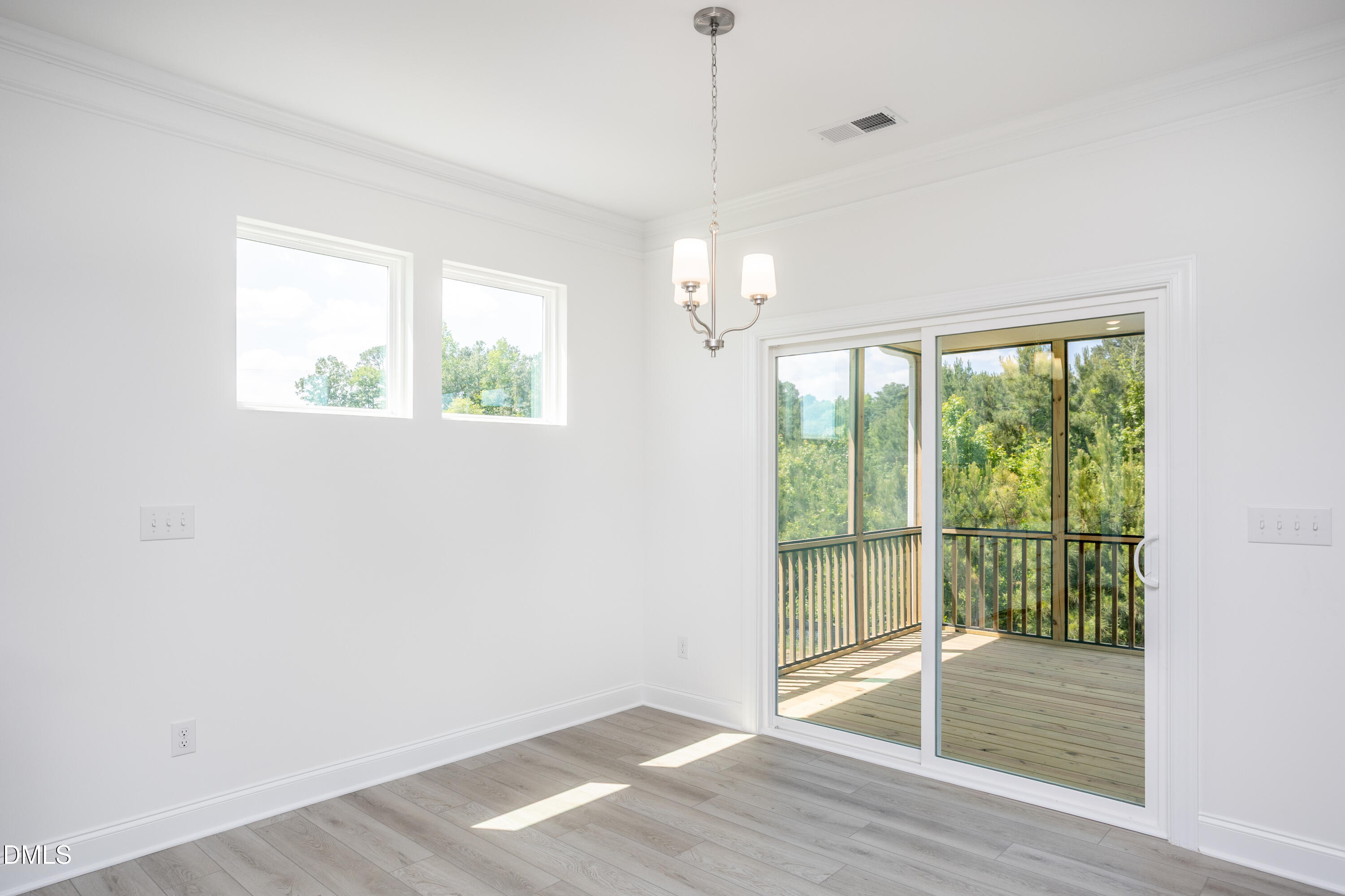 216 Cedar Rdg Trail Angier, NC 27501 - Photo 13 of 33 a view of empty room with wooden floor and fan