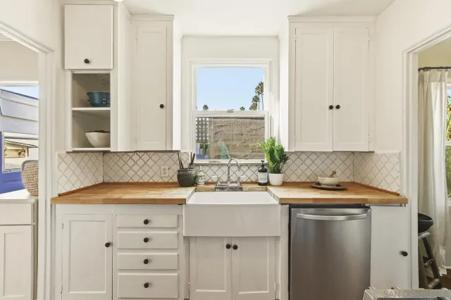 a kitchen with a refrigerator and a stove
