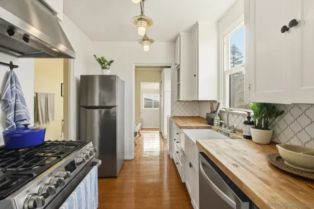 a view of hallway with wooden floor