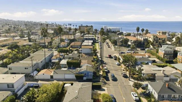 an aerial view of residential houses with outdoor space