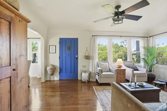 a living room with furniture and a fireplace