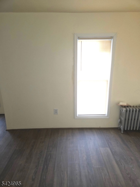 7 Filmore Street, Unit 2 Phillipsburg, NJ 08865 - Photo 11 of 14 an empty room with wooden floor and a window