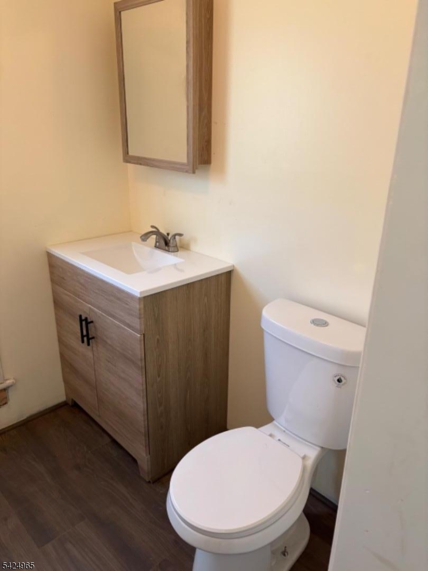 7 Filmore Street, Unit 2 Phillipsburg, NJ 08865 - Photo 14 of 14 a bathroom with a toilet a sink and mirror