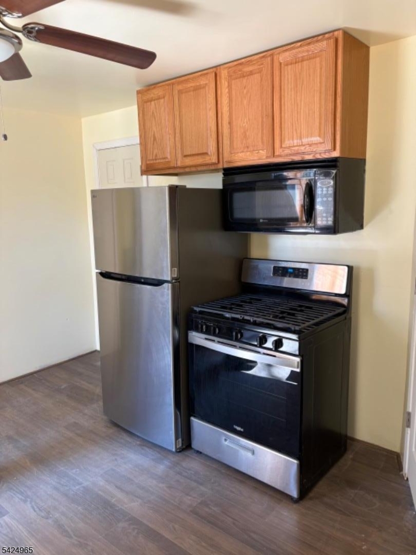 7 Filmore Street, Unit 2 Phillipsburg, NJ 08865 - Photo 4 of 14 a kitchen with granite countertop wooden cabinets and stainless steel appliances