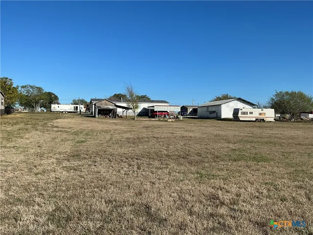a view of car parked on the side of the road