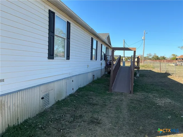 a view of a backyard with plants