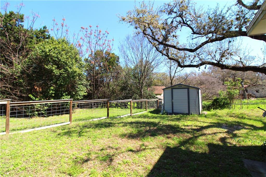 11705 Cherokee Street, Unit B Austin, TX 78753 - Photo 16 of 18 a view of a backyard with large trees