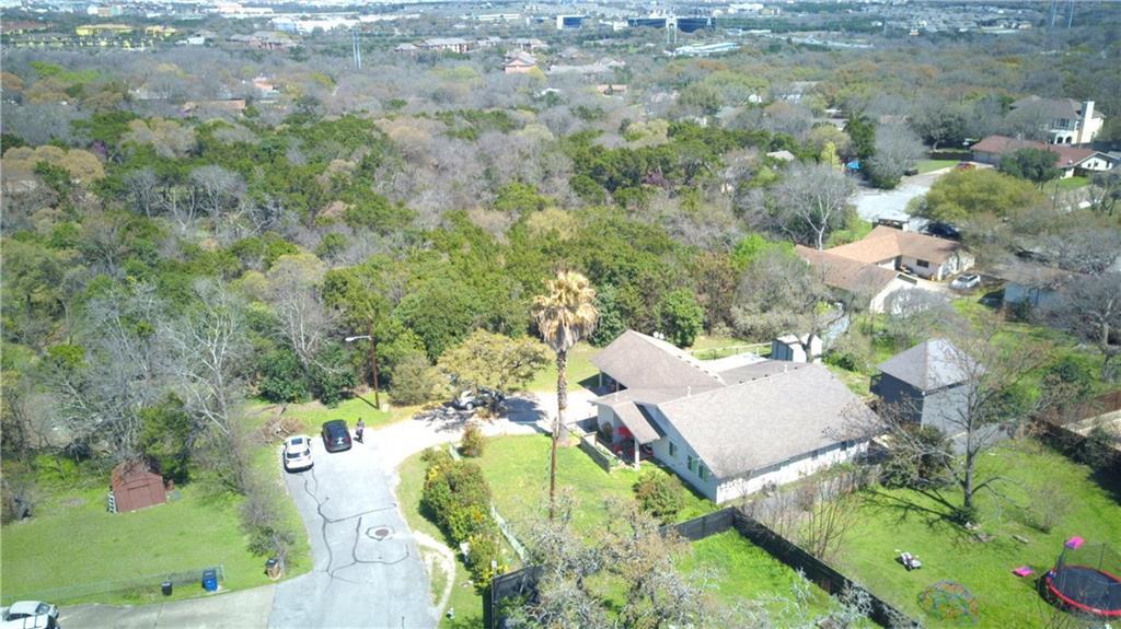 11705 Cherokee Street, Unit B Austin, TX 78753 - Photo 17 of 18 an aerial view of a house with a yard and lake view