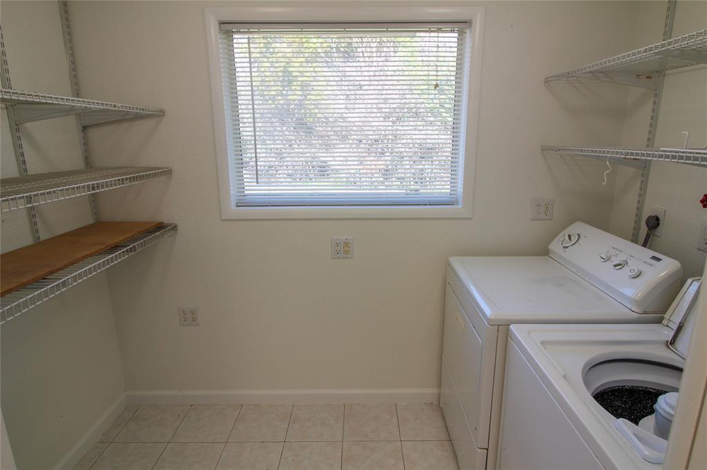 11705 Cherokee Street, Unit B Austin, TX 78753 - Photo 6 of 18 a utility room with dryer and washer