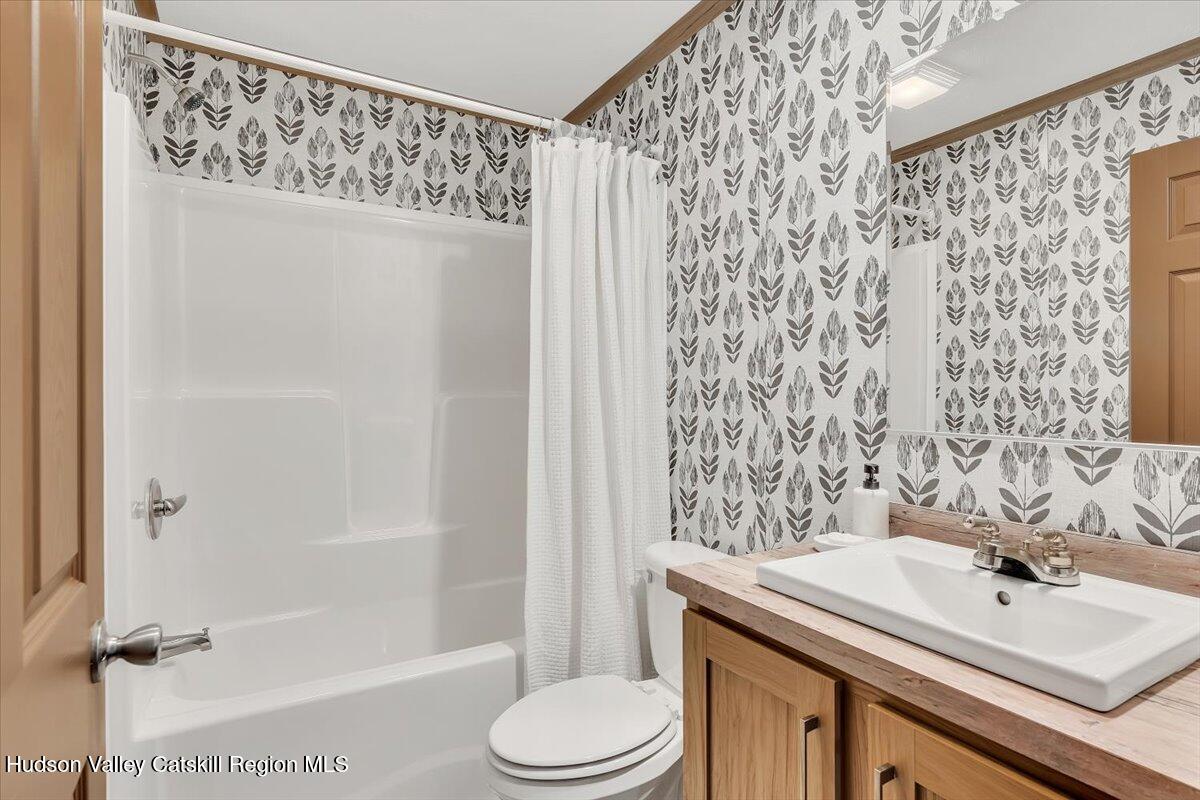 185 Old State Road, Unit 55 Broadalbin, NY 12025 - Photo 14 of 62 a bathroom with a sink toilet and shower