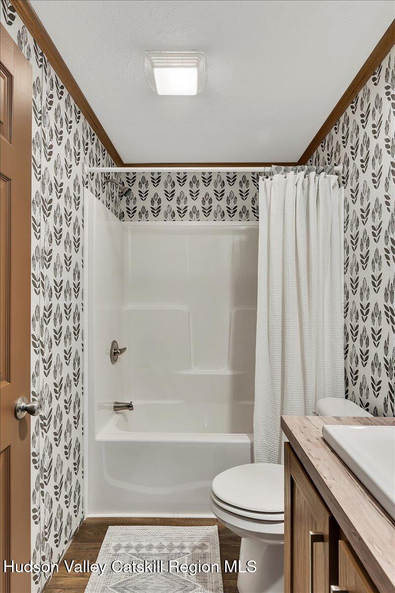 185 Old State Road, Unit 55 Broadalbin, NY 12025 - Photo 17 of 62 a bathroom with a granite countertop bathtub sink vanity and toilet