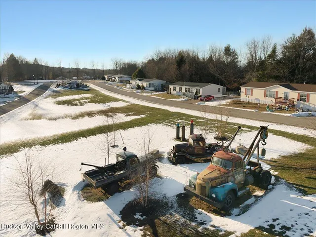 a view of wooden house with a large window