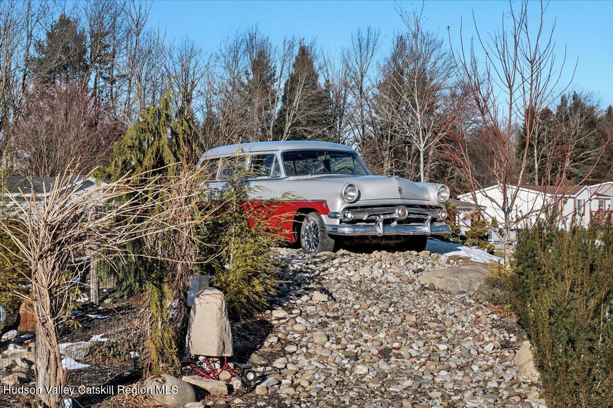185 Old State Road, Unit 55 Broadalbin, NY 12025 - Photo 43 of 62 a front view of a house with a yard and trees