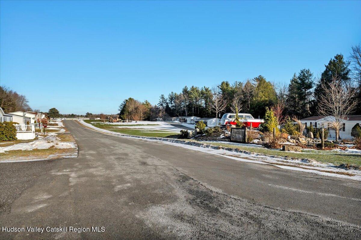 185 Old State Road, Unit 55 Broadalbin, NY 12025 - Photo 45 of 62 a car parked on the side of the road