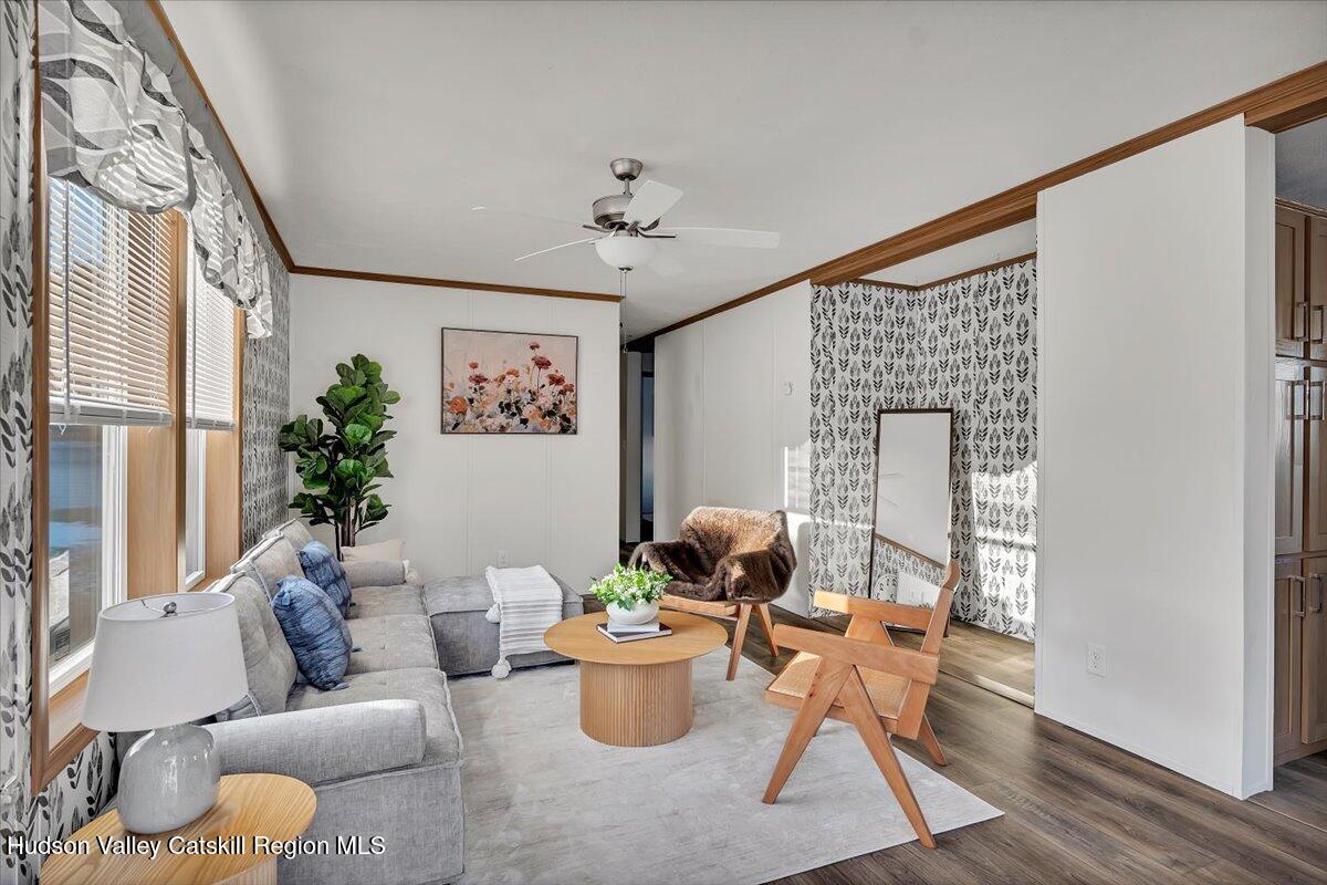 185 Old State Road, Unit 55 Broadalbin, NY 12025 - Photo 5 of 62 a living room with furniture and a large window
