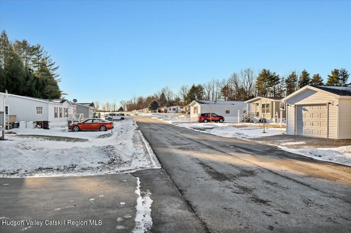 185 Old State Road, Unit 55 Broadalbin, NY 12025 - Photo 56 of 62 a view of a large white house with a yard