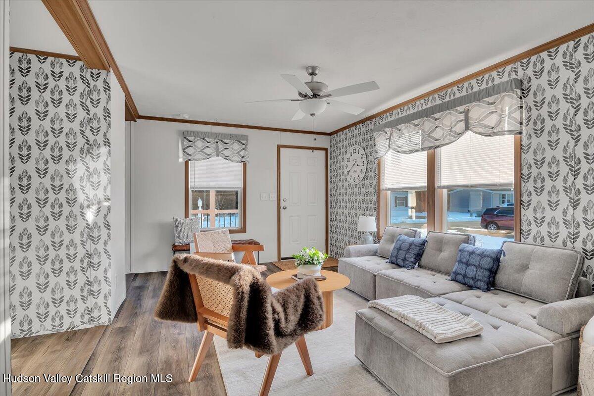 185 Old State Road, Unit 55 Broadalbin, NY 12025 - Photo 8 of 62 a living room with furniture and a large window