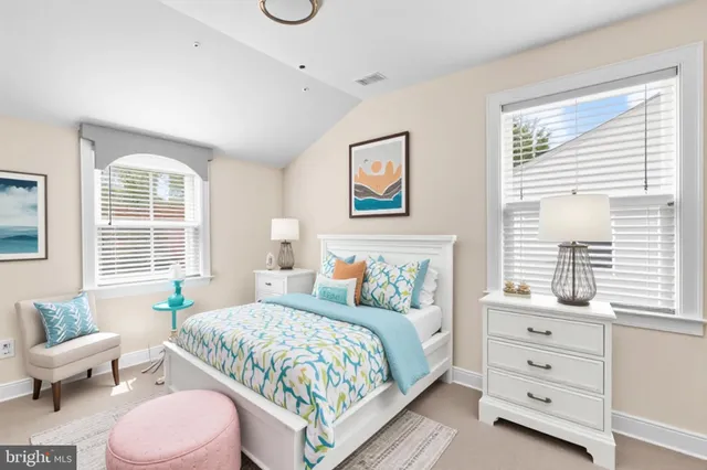 a bedroom with a bed and a couch