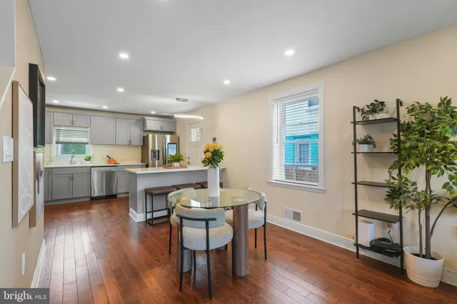 a kitchen with a table and chairs in it
