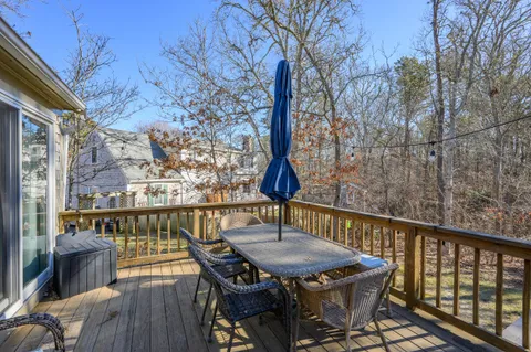 a view of a balcony with table and chairs