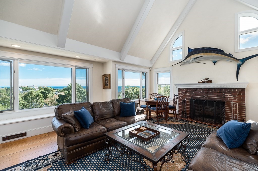 15 Cliff Road Gloucester, MA 01930 - Photo 13 of 42 a living room with furniture and a fireplace