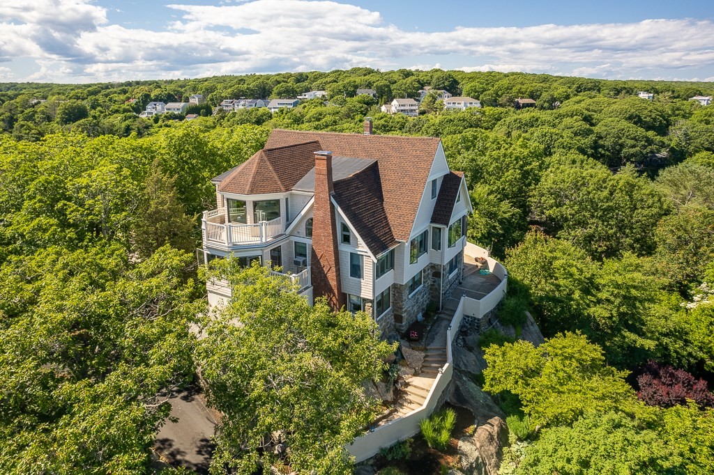 15 Cliff Road Gloucester, MA 01930 - Photo 2 of 42 an aerial view of a house with a yard and lake view