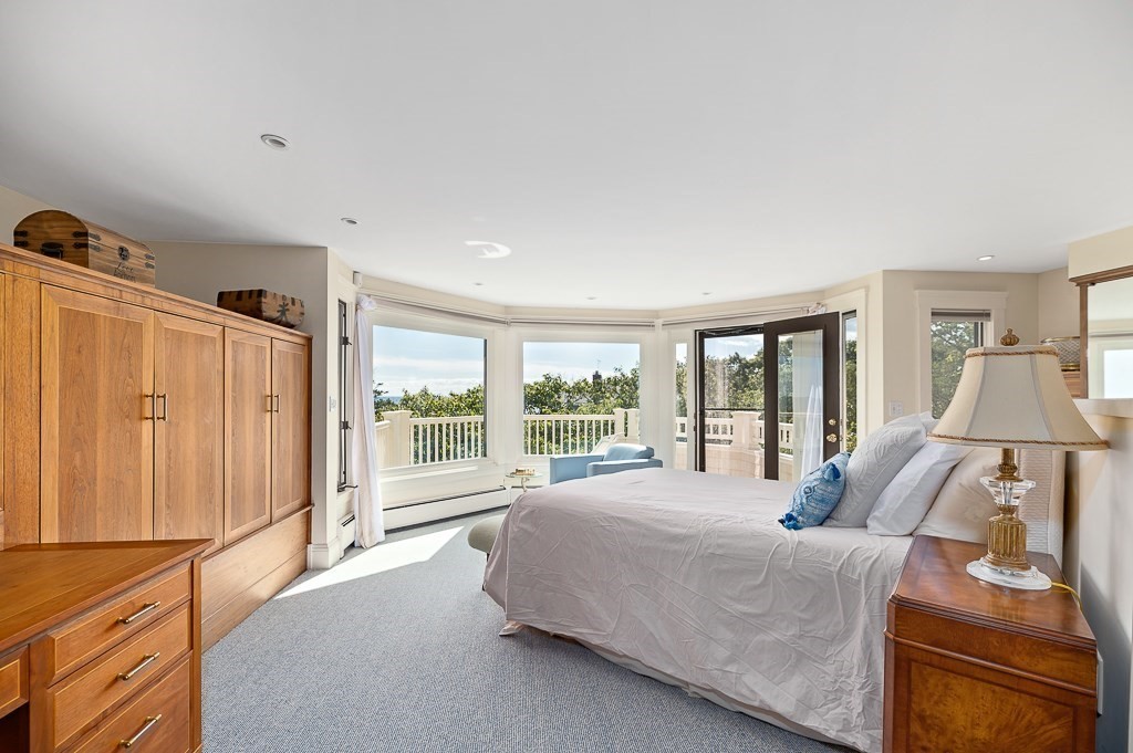 15 Cliff Road Gloucester, MA 01930 - Photo 21 of 42 a large bedroom with a bed and large window