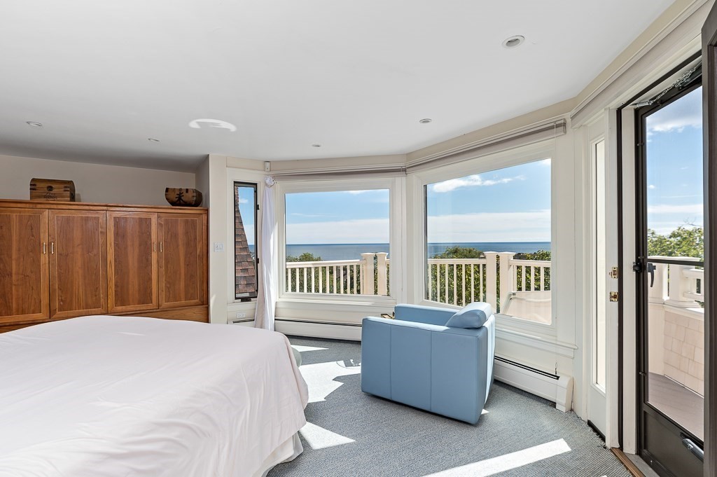 15 Cliff Road Gloucester, MA 01930 - Photo 22 of 42 a bedroom with a bed and a couch