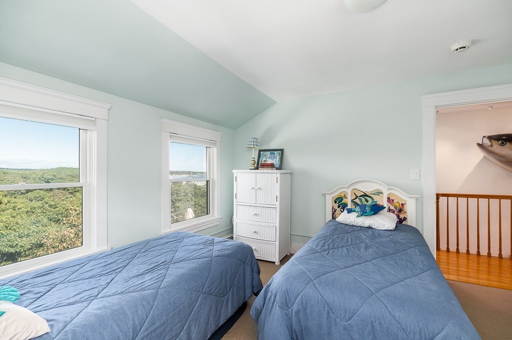 15 Cliff Road Gloucester, MA 01930 - Photo 26 of 42 a bedroom with two beds and a window