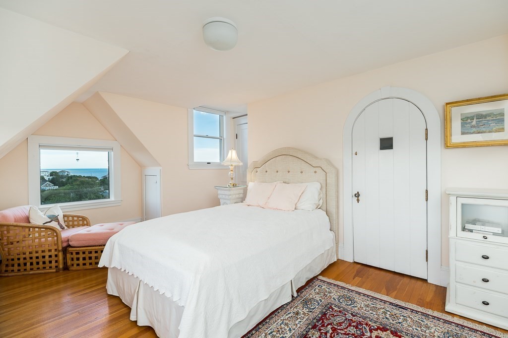 15 Cliff Road Gloucester, MA 01930 - Photo 27 of 42 a bedroom with a bed and wooden floor